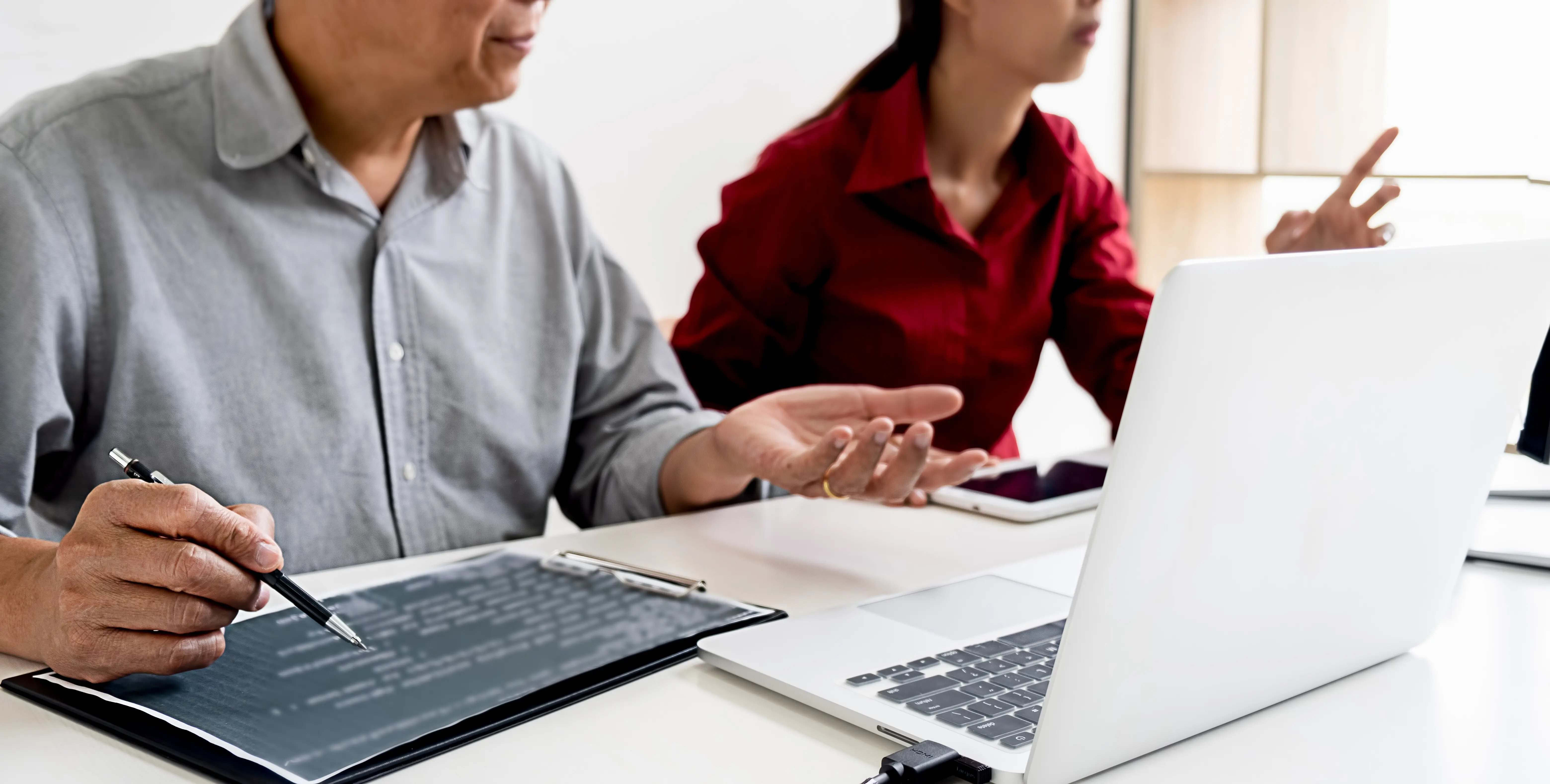 People using a mobile phone, viewed from a low angle.